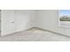 Bright bedroom with grey carpet and a window at 1692 Fallon Pass, Zephyrhills, FL 33541