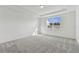 Spacious bedroom featuring grey carpet and a large window at 1692 Fallon Pass, Zephyrhills, FL 33541