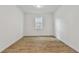 Bright bedroom with tile flooring and a window offering natural light at 1692 Fallon Pass, Zephyrhills, FL 33541