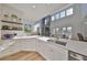 Modern kitchen featuring white cabinetry, quartz countertops, and a stylish sink at 415 Islebay Dr, Apollo Beach, FL 33572