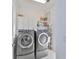 Laundry room with washer, dryer, and ample storage cabinets at 415 Islebay Dr, Apollo Beach, FL 33572