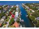 Aerial view of waterfront home with private dock and boat lift at 4923 W Melrose N Ave, Tampa, FL 33629