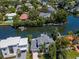 Aerial view of waterfront home and surrounding neighborhood at 4923 W Melrose N Ave, Tampa, FL 33629
