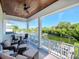 Relaxing balcony overlooking the water with seating for entertaining at 4923 W Melrose N Ave, Tampa, FL 33629