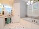 Elegant bathroom with a soaking tub, double vanity, and a makeup vanity at 4923 W Melrose N Ave, Tampa, FL 33629