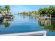 Scenic waterfront view of a peaceful canal with boats at 4923 W Melrose N Ave, Tampa, FL 33629