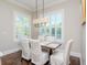 Elegant dining room with hardwood floors and large windows at 4923 W Melrose N Ave, Tampa, FL 33629