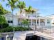 Two-story home with balcony, dock, and lush landscaping at 4923 W Melrose N Ave, Tampa, FL 33629