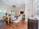 Open concept living room with built-in shelving and hardwood floors at 4923 W Melrose N Ave, Tampa, FL 33629