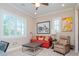 Cozy office space with a comfortable couch, large artwork, and plenty of natural light at 4923 W Melrose N Ave, Tampa, FL 33629