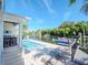 Inviting pool area with lounge chairs and canal view at 4923 W Melrose N Ave, Tampa, FL 33629