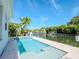 Relaxing swimming pool with tiled accents next to canal at 4923 W Melrose N Ave, Tampa, FL 33629