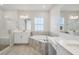 Spa-like bathroom with a soaking tub, walk-in shower, and double vanity at 12977 Long Valley Cir, Spring Hill, FL 34609