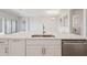 Modern kitchen featuring a large island with white cabinets and quartz countertops at 12977 Long Valley Cir, Spring Hill, FL 34609