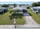 Single-Gathering home with driveway and carport, nicely landscaped lawn at 15 Hamilton Ln # 7, Palm Harbor, FL 34684