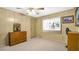 Guest bedroom with dresser and window at 15 Hamilton Ln # 7, Palm Harbor, FL 34684