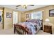 Bedroom with double bed, nightstand, and ceiling fan at 15 Hamilton Ln # 7, Palm Harbor, FL 34684