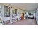 Covered carport with storage and access to the home at 15 Hamilton Ln # 7, Palm Harbor, FL 34684