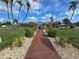 Attractive community clubhouse and brick pathway at 15 Hamilton Ln # 7, Palm Harbor, FL 34684