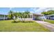 Single-Gathering home with carport and palm trees in front at 15 Hamilton Ln # 7, Palm Harbor, FL 34684