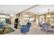 Open living room and kitchen with a dining area and recliner at 15 Hamilton Ln # 7, Palm Harbor, FL 34684
