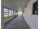 Enclosed porch with windows overlooking the community at 15 Hamilton Ln # 7, Palm Harbor, FL 34684