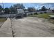 RV parking area with a camper and several boat trailers at 15 Hamilton Ln # 7, Palm Harbor, FL 34684