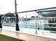 Community shuffleboard courts with covered seating areas at 15 Hamilton Ln # 7, Palm Harbor, FL 34684