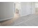 Bright bedroom with grey carpet and en-suite bathroom at 3437 Yellow Leaf Cir, Spring Hill, FL 34609