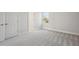 Simple bedroom with carpet, window and door to another room at 3437 Yellow Leaf Cir, Spring Hill, FL 34609