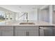 Modern kitchen island with quartz countertops and stainless steel sink at 3437 Yellow Leaf Cir, Spring Hill, FL 34609