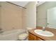Standard bathroom featuring a shower-tub combo and vanity at 7806 Grasmere Dr, Land O Lakes, FL 34637