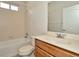 This bathroom has a tub and shower combo with tile surround, and neutral walls at 7806 Grasmere Dr, Land O Lakes, FL 34637