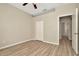 This bedroom has wood floors and neutral colored walls at 7806 Grasmere Dr, Land O Lakes, FL 34637