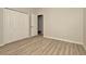 This bedroom features a closet and wood-look floors at 7806 Grasmere Dr, Land O Lakes, FL 34637