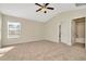 Spacious carpeted bedroom with plenty of natural light at 7806 Grasmere Dr, Land O Lakes, FL 34637