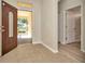 Inviting entryway featuring tile floors and an open doorway at 7806 Grasmere Dr, Land O Lakes, FL 34637