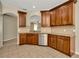 Kitchen boasts stainless steel appliances, granite countertops, and ample cabinet space at 7806 Grasmere Dr, Land O Lakes, FL 34637