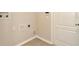 Utility room with tile floors and access door at 7806 Grasmere Dr, Land O Lakes, FL 34637