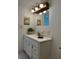 Vanity with mirror and ample storage at 10369 Paradise Blvd # 58, Treasure Island, FL 33706