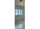 Bright bedroom with light wood flooring and window at 10369 Paradise Blvd # 58, Treasure Island, FL 33706