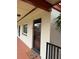 Exterior view of condo building, showing building number and entrance at 10369 Paradise Blvd # 58, Treasure Island, FL 33706