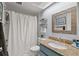 Clean bathroom with shower and granite countertop at 1118 2Nd S Ave, Tierra Verde, FL 33715