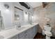 Double vanity bathroom with white quartz countertops at 1118 2Nd S Ave, Tierra Verde, FL 33715