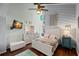 Guest bedroom with white bed frame and teal dresser at 1118 2Nd S Ave, Tierra Verde, FL 33715