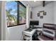 Home office with corner desk and leather office chair at 1118 2Nd S Ave, Tierra Verde, FL 33715