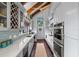 Bright kitchen with stainless steel appliances and wood flooring at 1118 2Nd S Ave, Tierra Verde, FL 33715