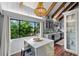 Modern kitchen with white quartz counters, gray cabinets, and a large island at 1118 2Nd S Ave, Tierra Verde, FL 33715