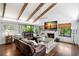 Relaxing living room with hardwood floors, fireplace, and sectional sofa at 1118 2Nd S Ave, Tierra Verde, FL 33715
