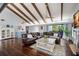 Large living room with hardwood floors, a fireplace, and comfortable seating at 1118 2Nd S Ave, Tierra Verde, FL 33715